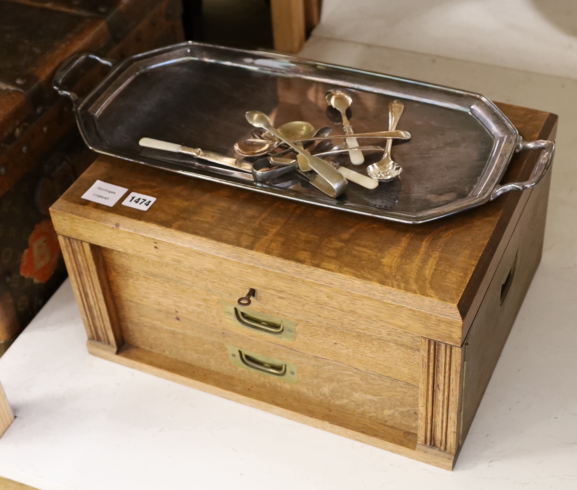 An oak cased set of twelve pair of silver plated cutlery and other plated wares